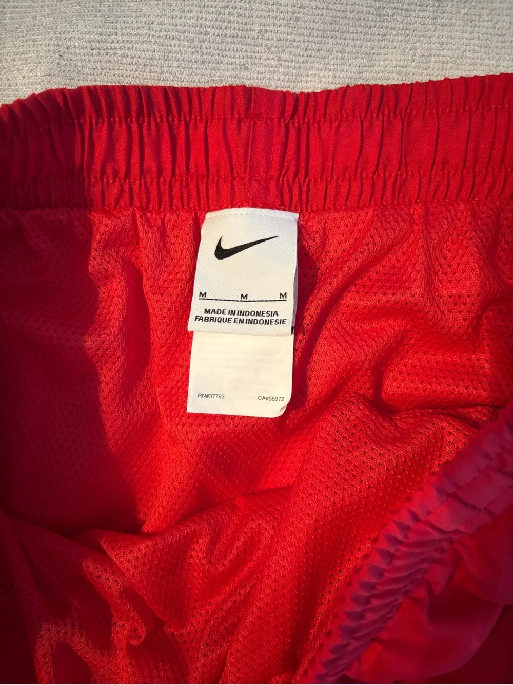 Nike Men’s Red Swim Trunks with Black Logo Tape